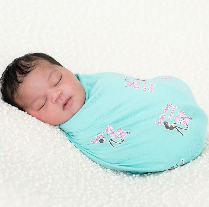 Newborn baby sleeping wrapped up