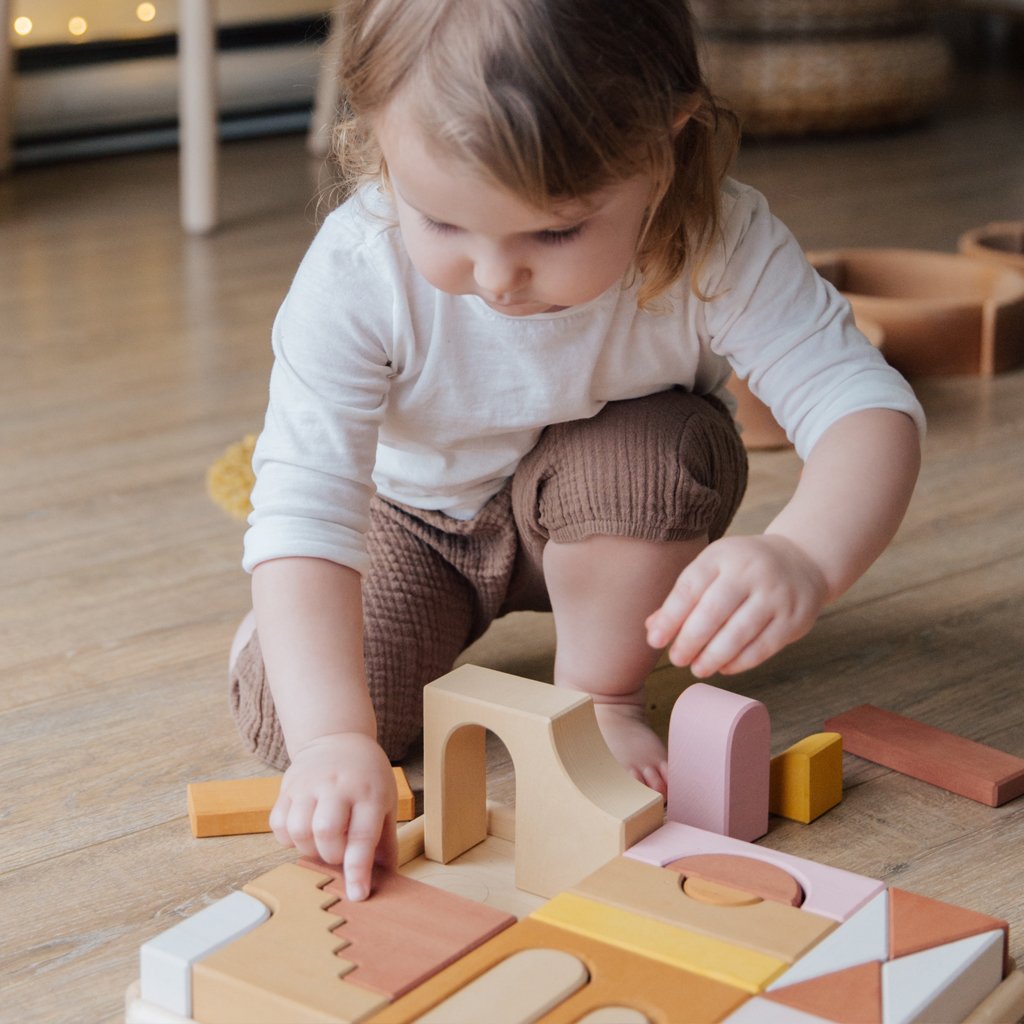 Toddler playing with blocks