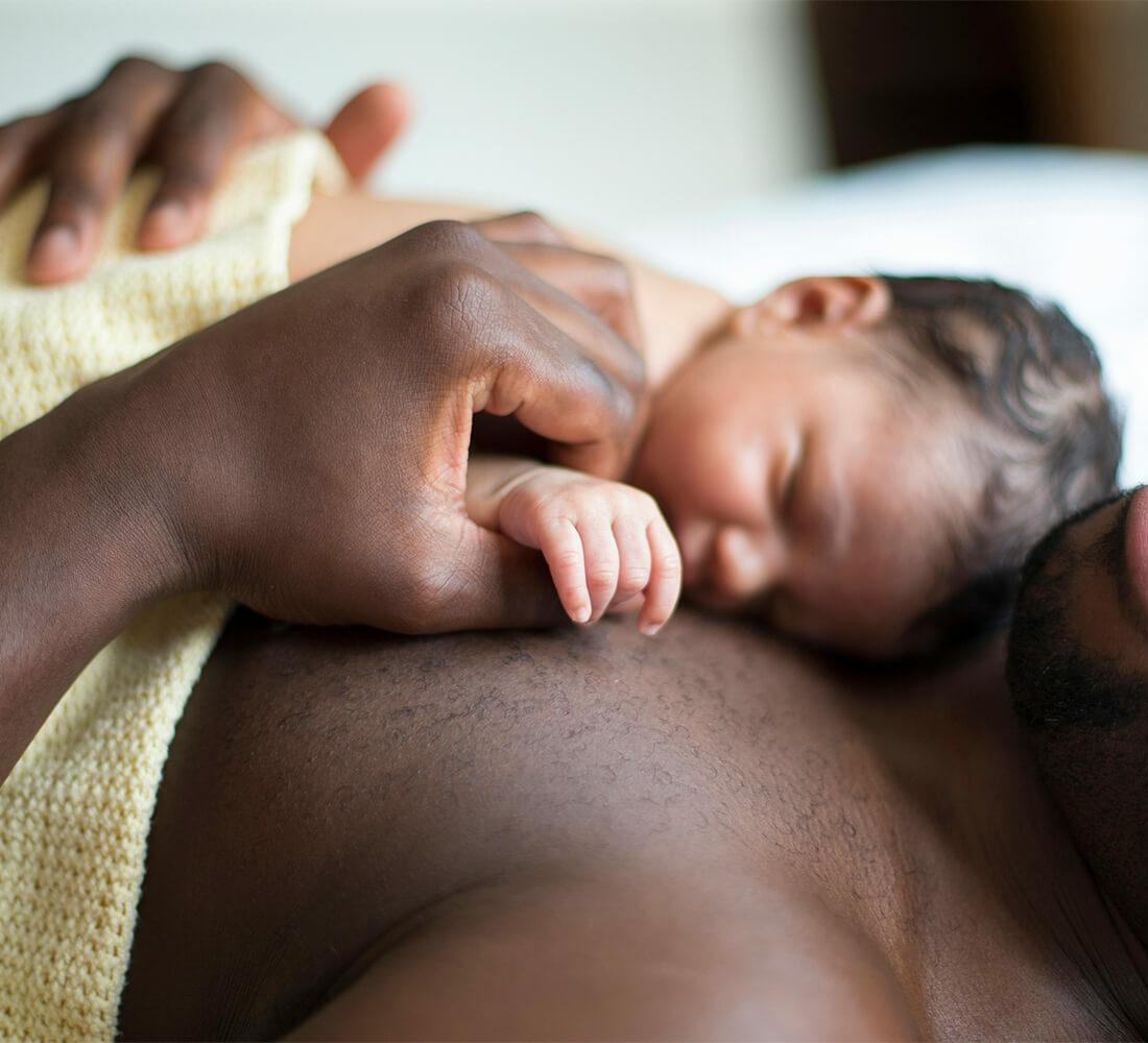 Baby sleeping on dads chest